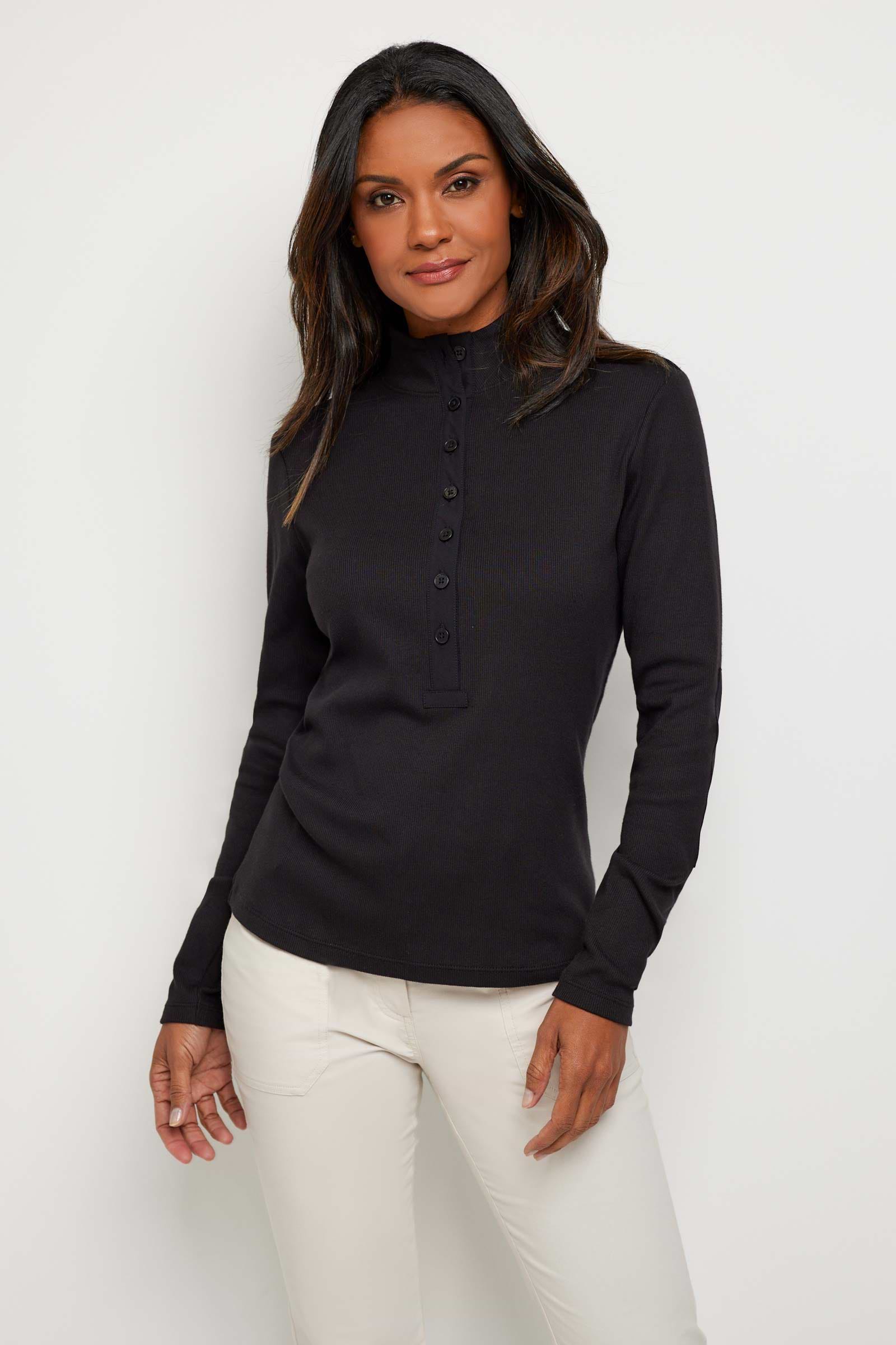 The Best Travel Top. Woman Showing the Front of a Monroe Henley Top in Black.