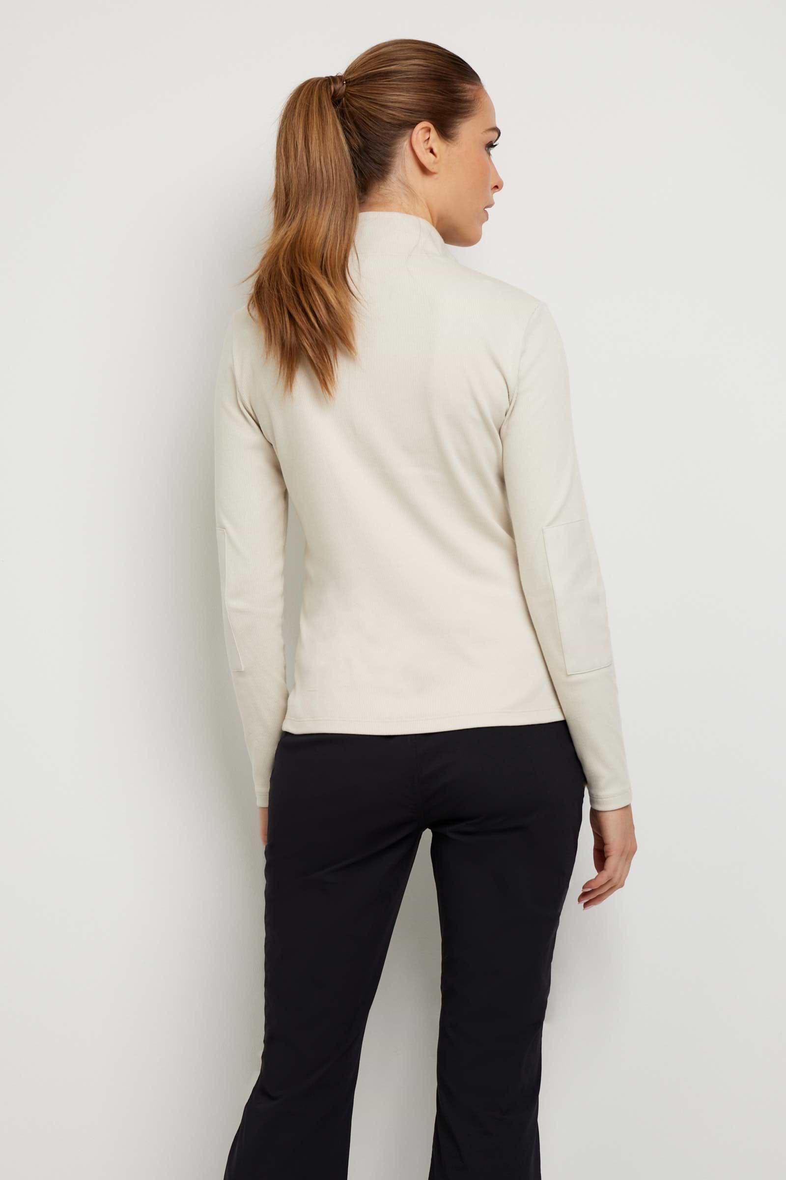 The Best Travel Top. Woman Showing the Back Profile of a Monroe Henley Top in Stone.