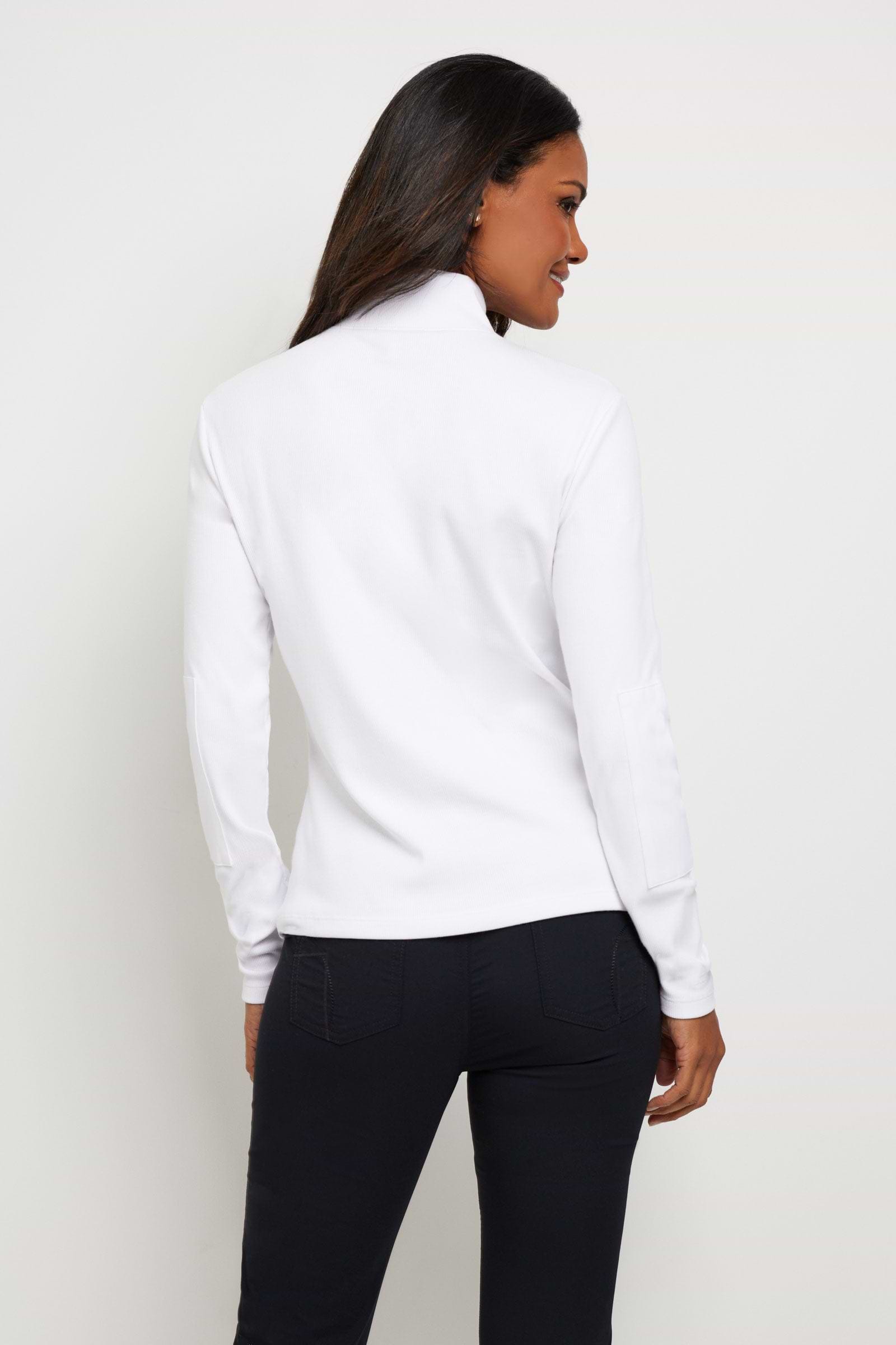 The Best Travel Top. Woman Showing the Back Profile of a Monroe Henley Top in White.