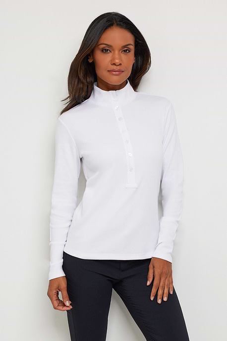 The Best Travel Top. Woman Showing the Front Profile of a Monroe Henley Top in White.