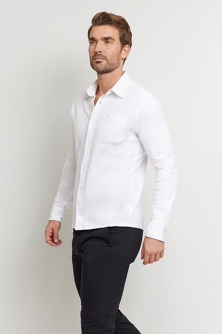 The Best Travel Top. Man Showing the Front Profile of a Men's Nick Top in White.