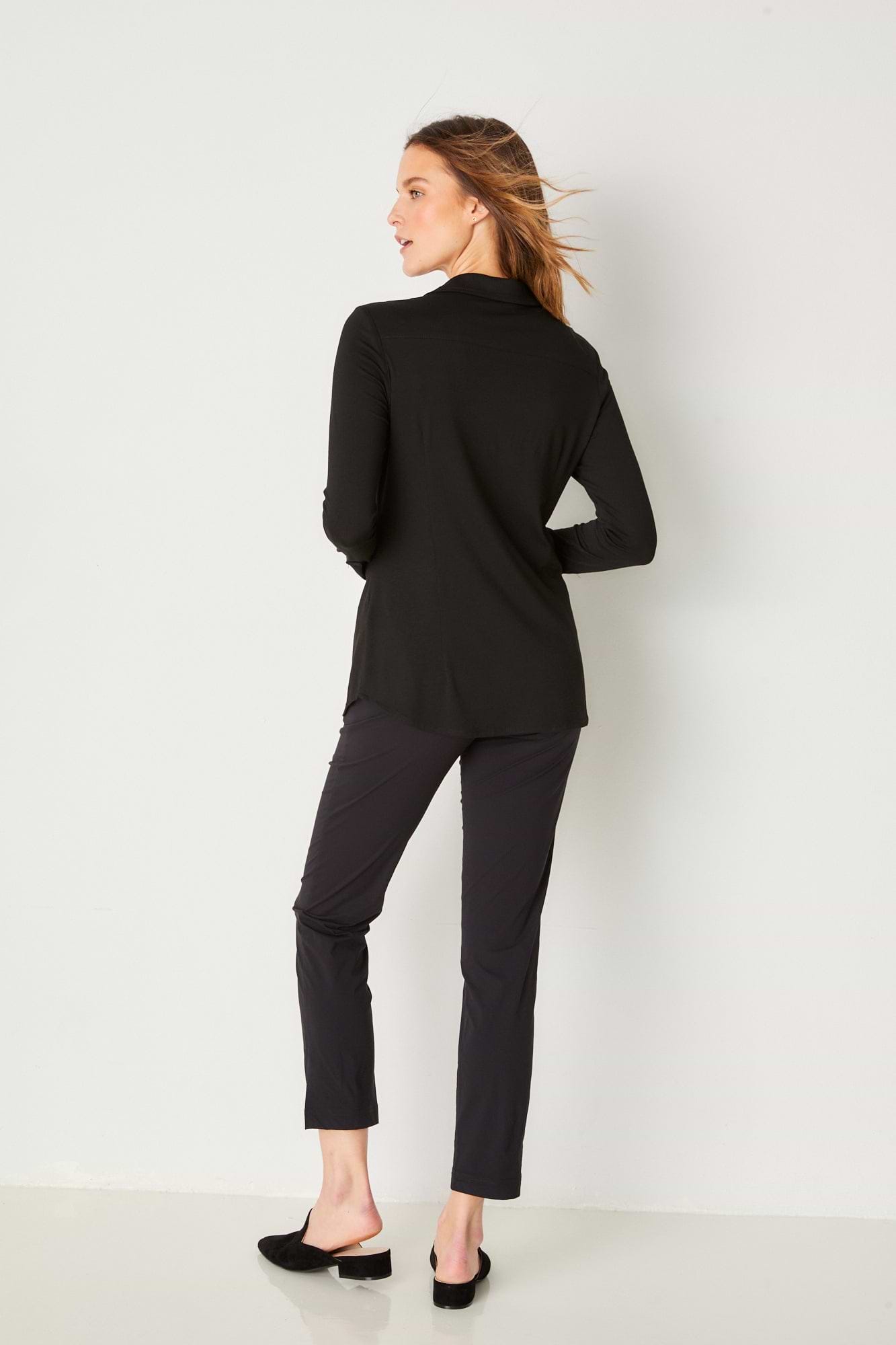 The Best Travel Shirt. Woman Showing the Back Profile of a Nikki Longsleeve Jersey Shirt in Black