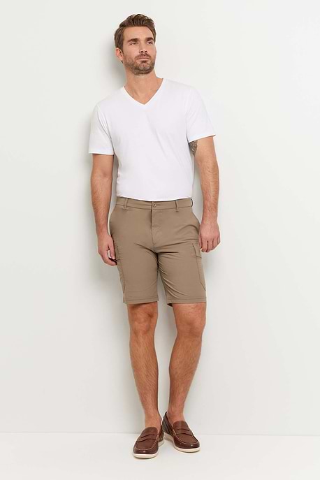 The Best Travel Shorts. Man Showing the Front Profile of a Men's Randy Short in Khaki.