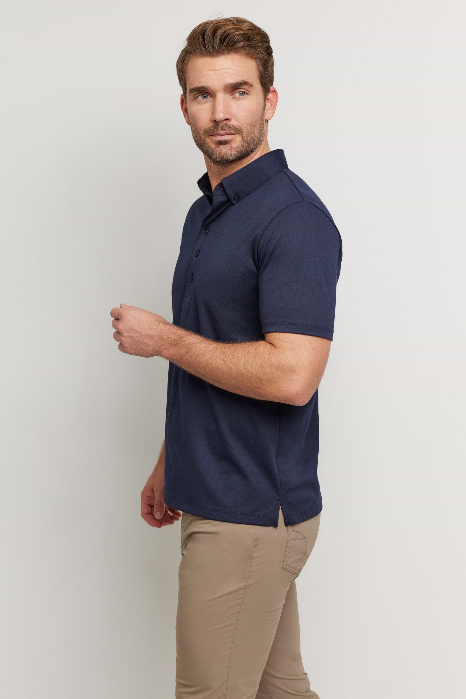 The Best Travel Top. Man Showing the Side Profile of a Men's Ryan Polo in Navy.