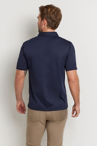 The Best Travel Top. Man Showing the Back Profile of a Men's Ryan Polo in Navy.