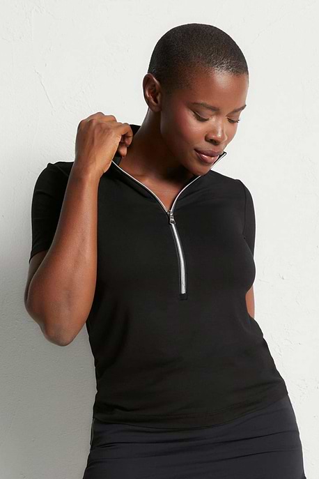 The Best Travel Top. Woman Showing the Front Profile of a Serena Top in Black.