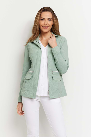 The Best Travel Jacket. Woman Showing the Front Profile of an Embossed Kenya Jacket in Cheetah Sage.
