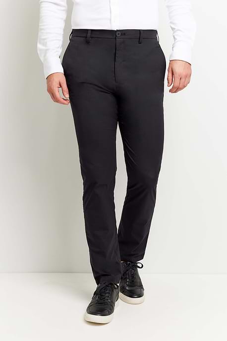 The Best Travel Pant. Man Showing the Front Profile of a Men's Stewart Pant in Black.