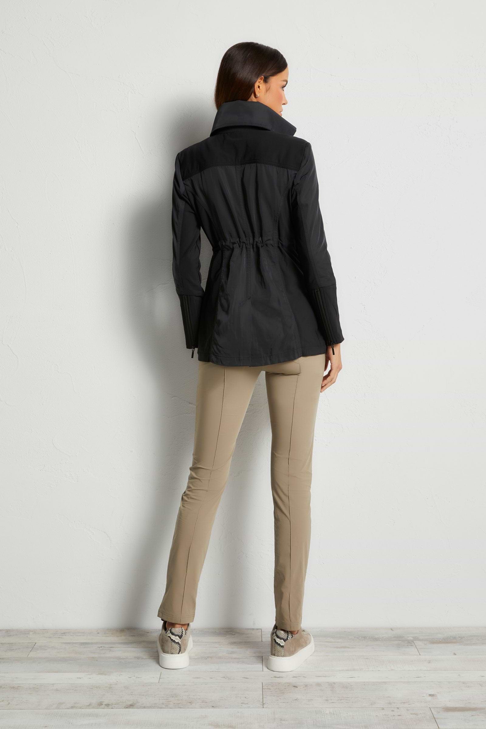 The Best Travel Jacket. Woman Showing the Back Profile of a Travel City Slick Jacket in Black