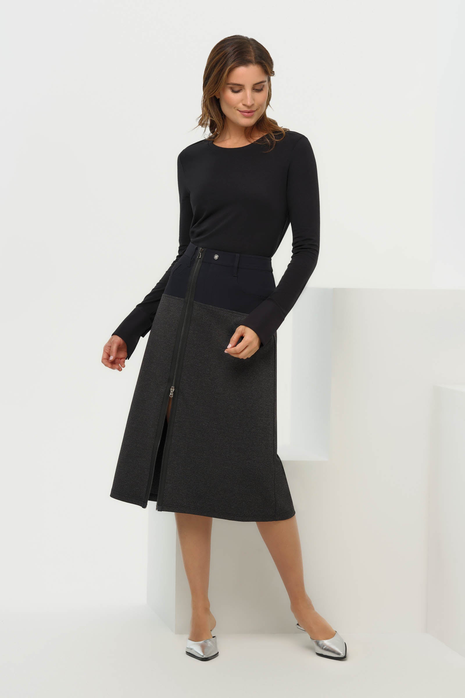 Last view of the Zita Ponte Midi Skirt highlighting the sleek silhouette and textured fabric.