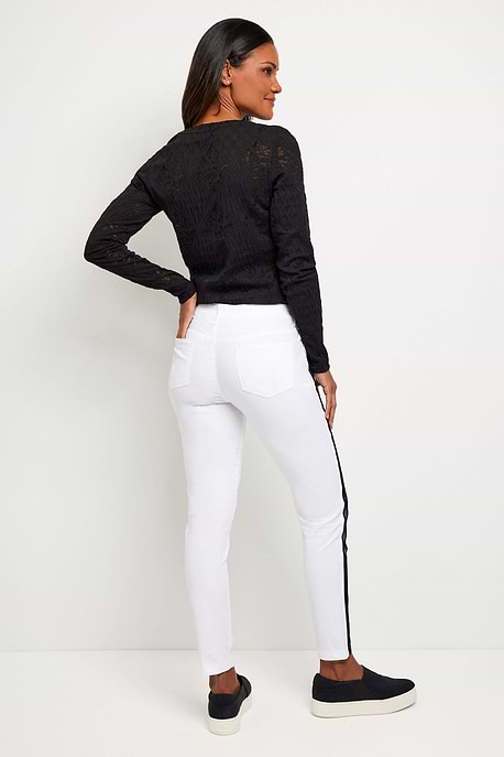 The Best Travel Pant. Woman Showing the Back Profile of a Luisa Stripe Pant in White/Black.