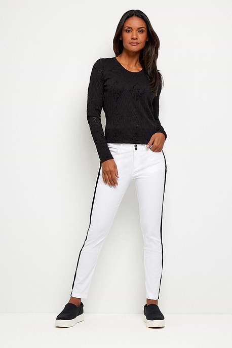 The Best Travel Pant. Woman Showing the Front Profile of a Luisa Stripe Pant in White/Black.