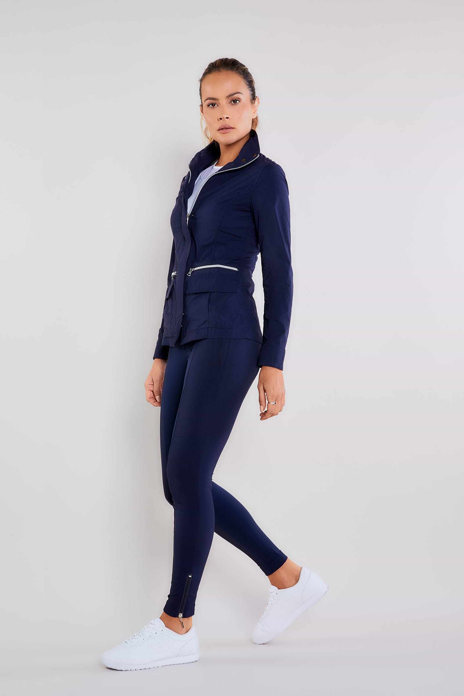 The Best Travel Pants. Woman Showing the Side Profile of the Allie Pant in Navy