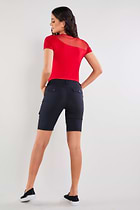 The Best Travel Shorts. Woman Showing the Back Profile of an Apiedi Shorts in Black.
