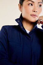 The Best Travel Fleece-Lined Jacket. Woman Holding the Collar of a Kenya Cozy Fleece-Lined Jacket in Navy