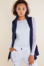 The Best Travel Vest. Woman Showing the Front Profile of a Delaney Travel Vest in Navy