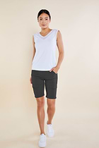 The Best Travel Shorts. Woman Showing the Front Profile of an Apiedi Shorts in Grey.