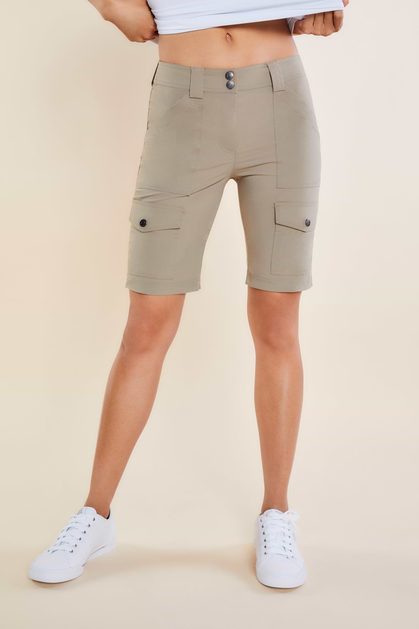 The Best Travel Shorts. Woman Showing the Front Profile of an Apiedi Shorts in Khaki.