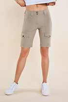 The Best Travel Shorts. Woman Showing the Front Profile of an Apiedi Shorts in Khaki.