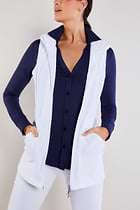 The Best Travel Vest. Woman Showing the Front Profile of a Delaney Travel Vest in White