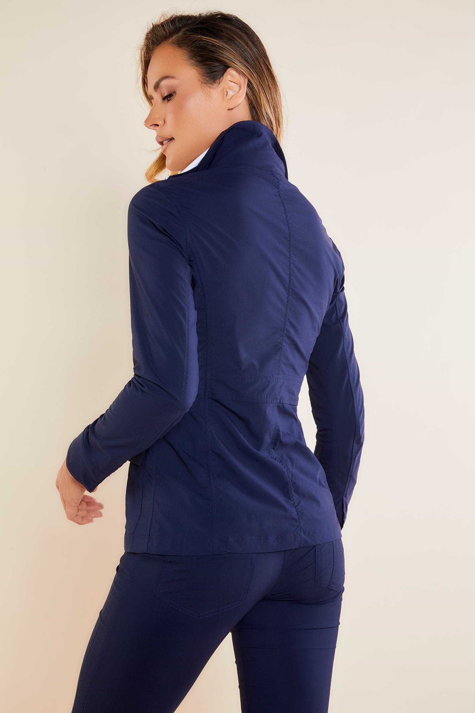 The Best Travel Safari Jacket. Woman Showing the Back Profile of a Safari Jacket in Navy