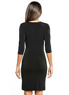 The Best Travel Dress. Woman Showing the Black Profile of a Marine Travel Dress in Black
