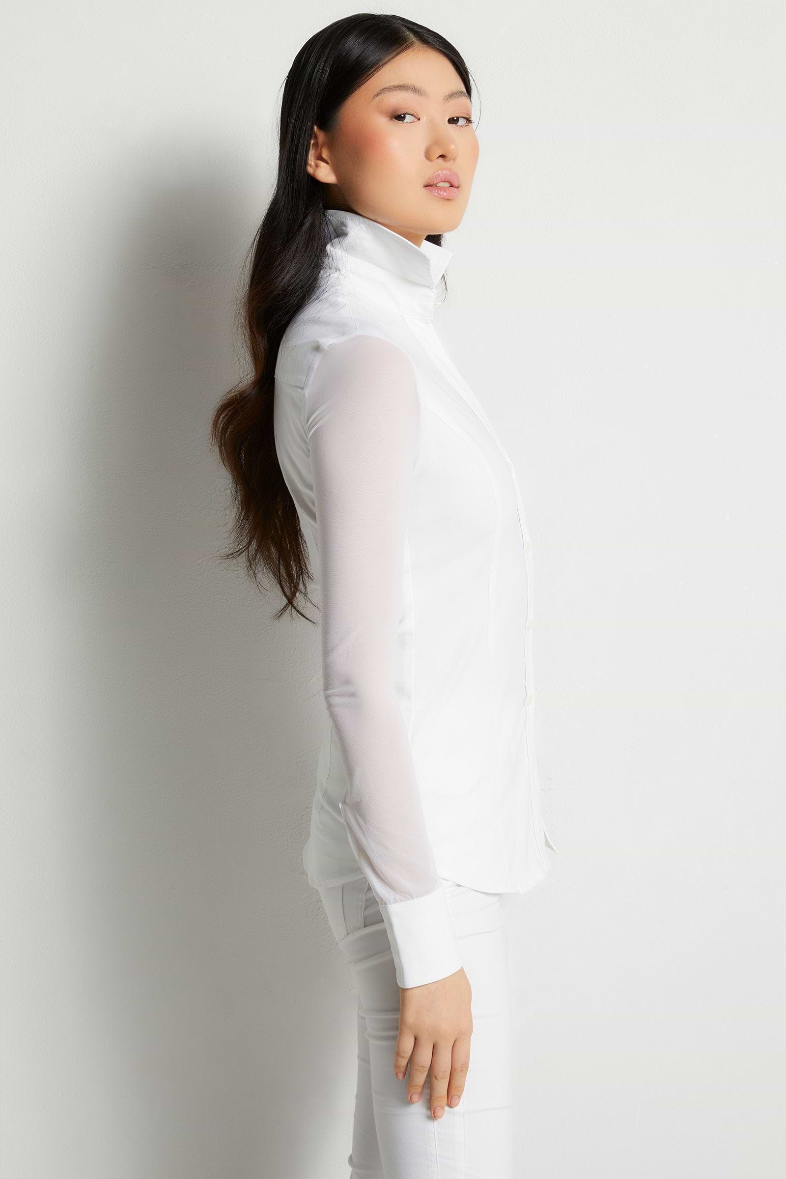 The Best Travel Shirt. Woman Showing the Side Profile of a Beth Button Front Shirt in White
