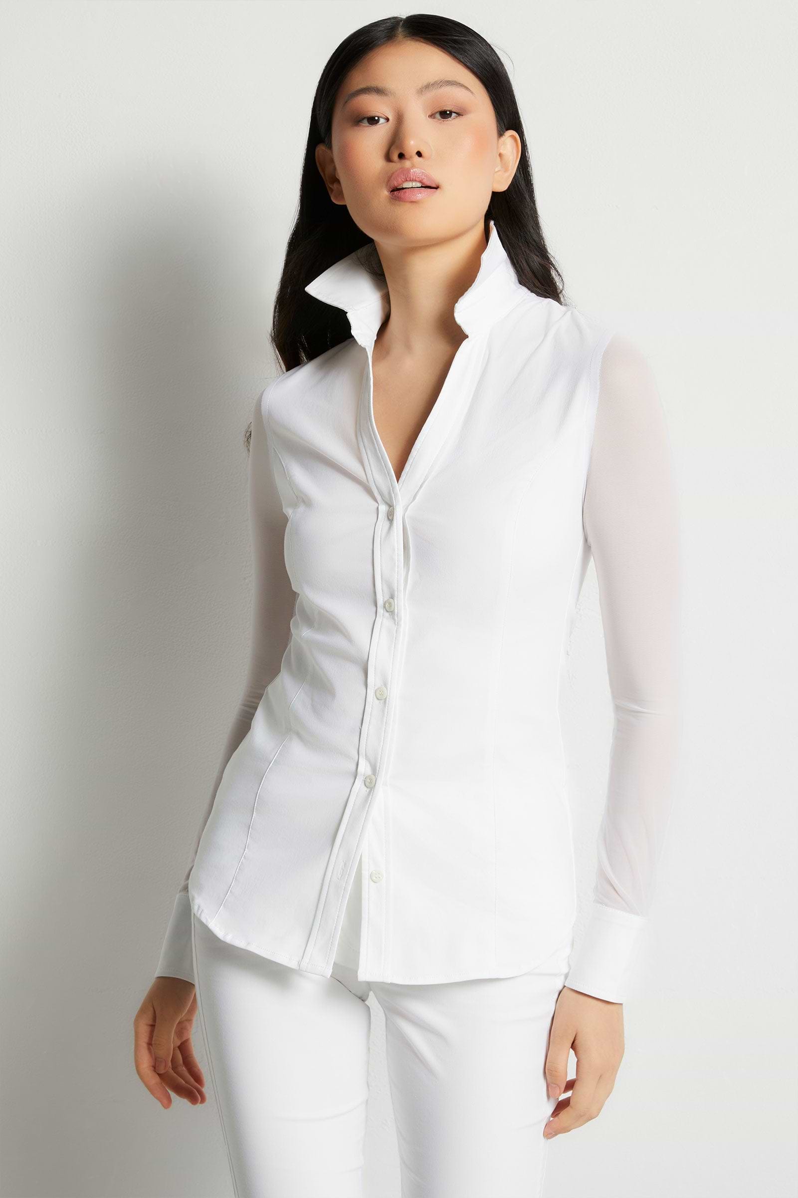 The Best Travel Shirt. Woman Showing the Front Profile of a Beth Button Front Shirt in White
