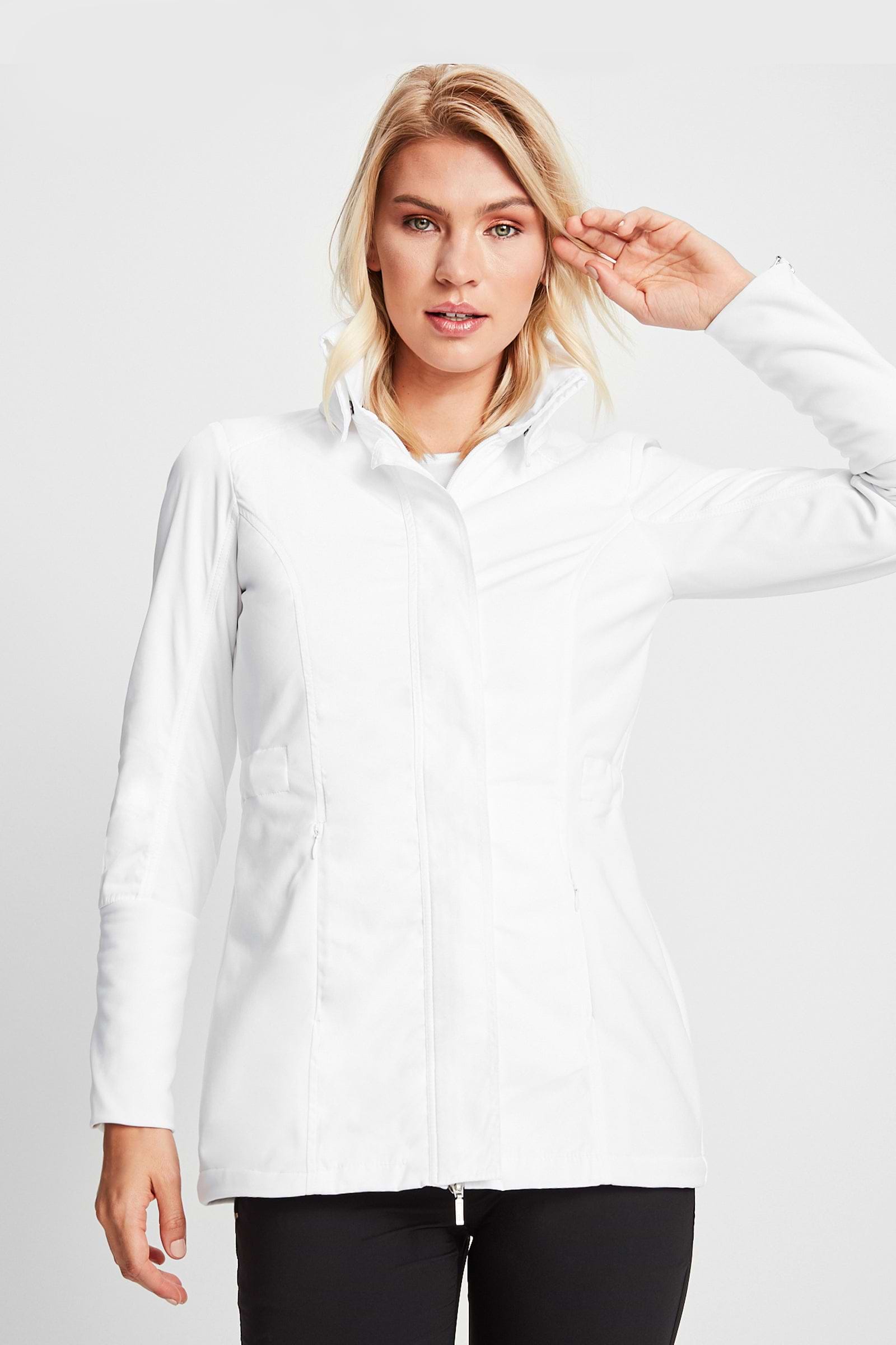The Best Travel Jacket. Woman Showing the Front Profile of a Travel City Slick Jacket in White