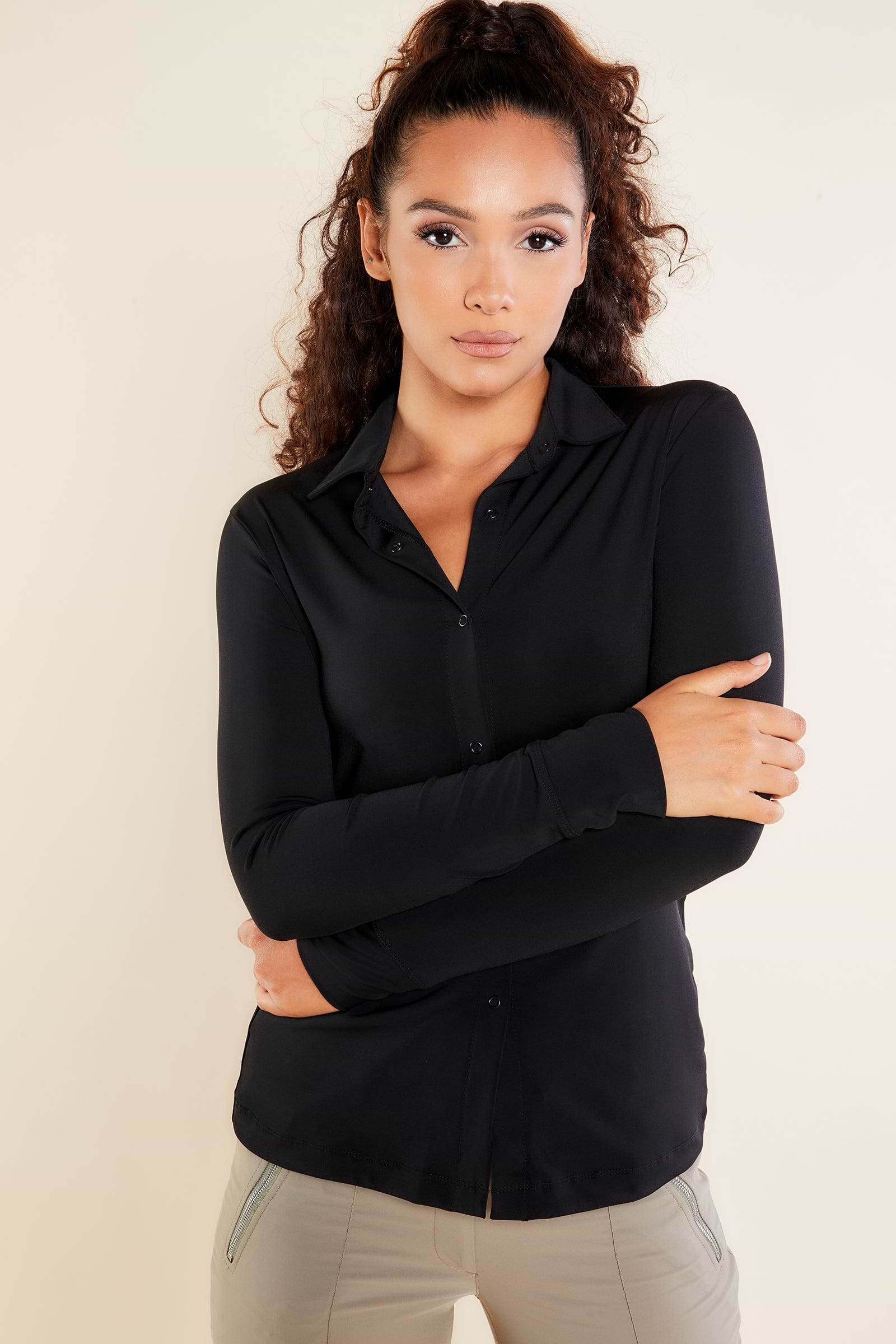 The Best Travel Top. Woman Showing the Front Profile of a Danica Snap On Super Jersey Top in Black