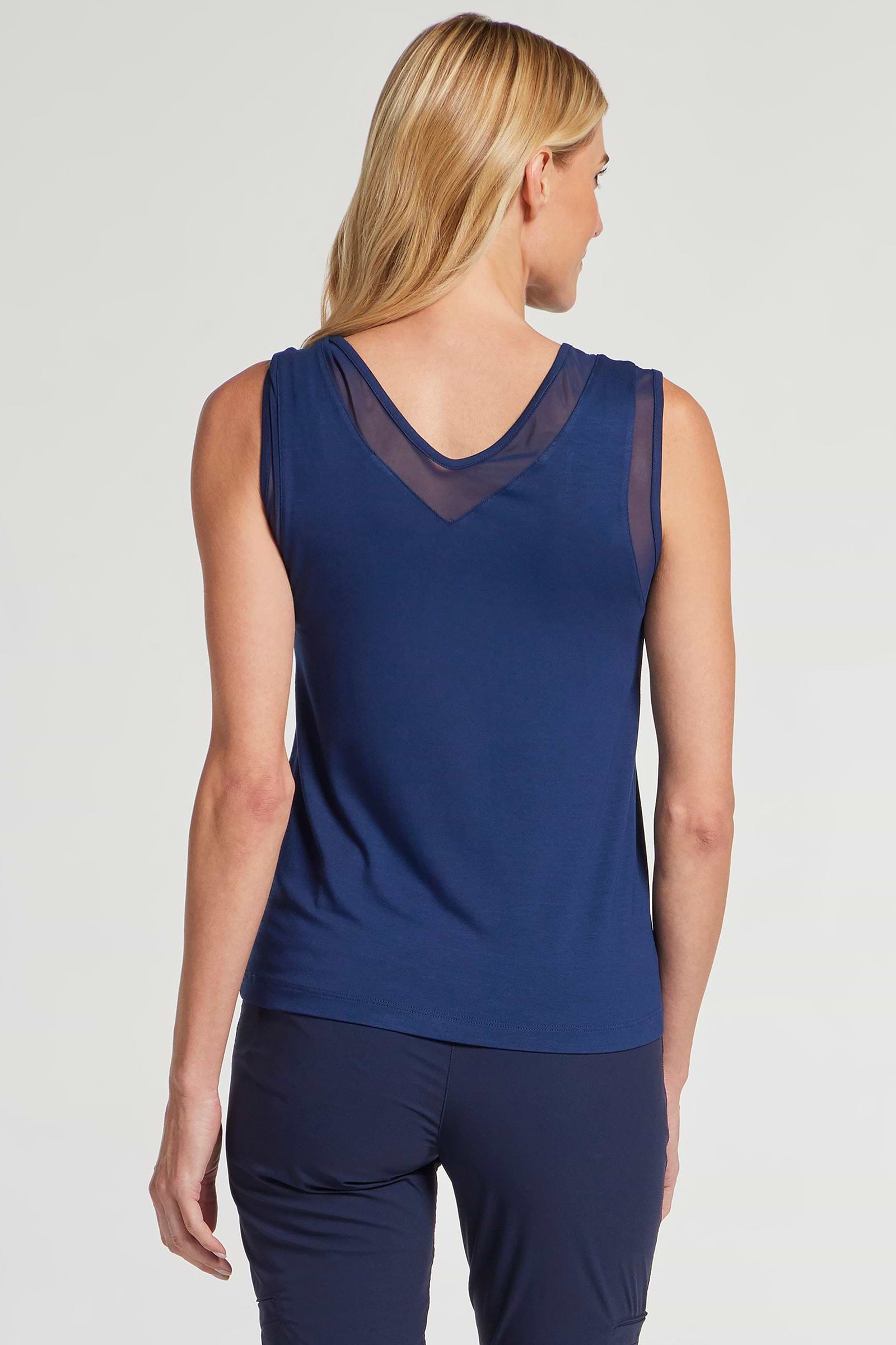 The Best Travel Tank Top. Woman Showing the Back Profile of a Jackson Pima Tank in Navy.