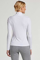 The Best Travel Top. Woman Showing the Back Profile of a Stacey Top in White.
