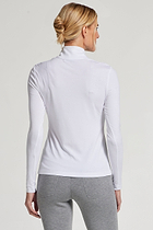 The Best Travel Top. Woman Showing the Back Profile of a Stacey Top in White.