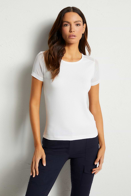 The Best Travel Shirt. Woman Showing the Front Profile of a Melissa Pima Cotton T-Shirt in White