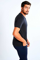 The Best Travel Top. Man Showing the Side Profile of a Men's Vince Top in Black.