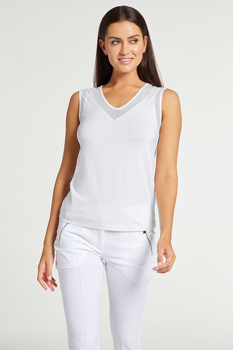 The Best Travel Tank Top. Woman Showing the Front Profile of a Jackson Pima Tank in White.