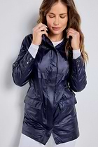 The Best Travel Jacket. Woman Showing the Front Profile of a Ramona Windbreaker Jacket in Navy.
