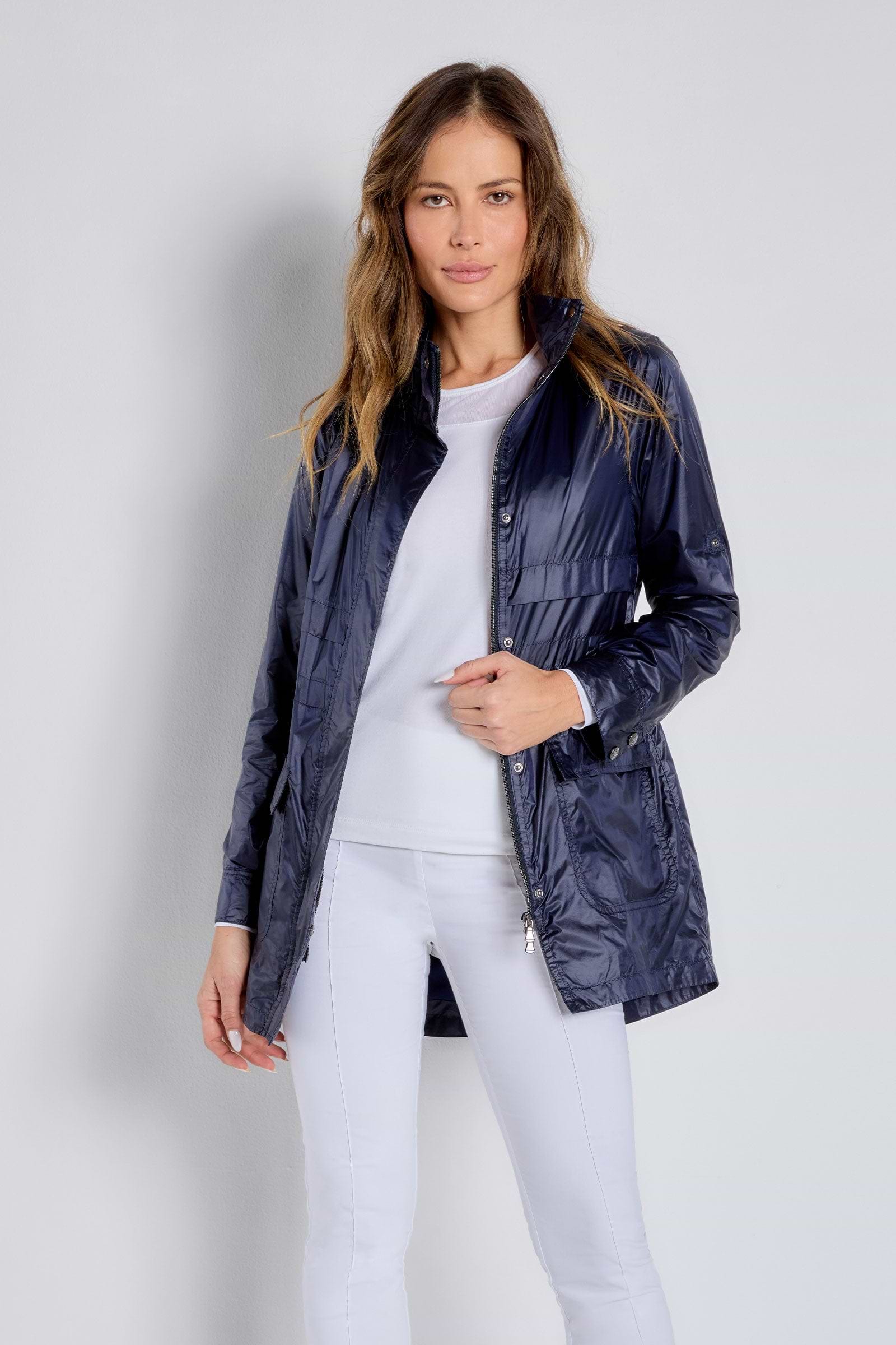 The Best Travel Jacket. Woman Showing the Front Profile of a Ramona Windbreaker Jacket in Navy.