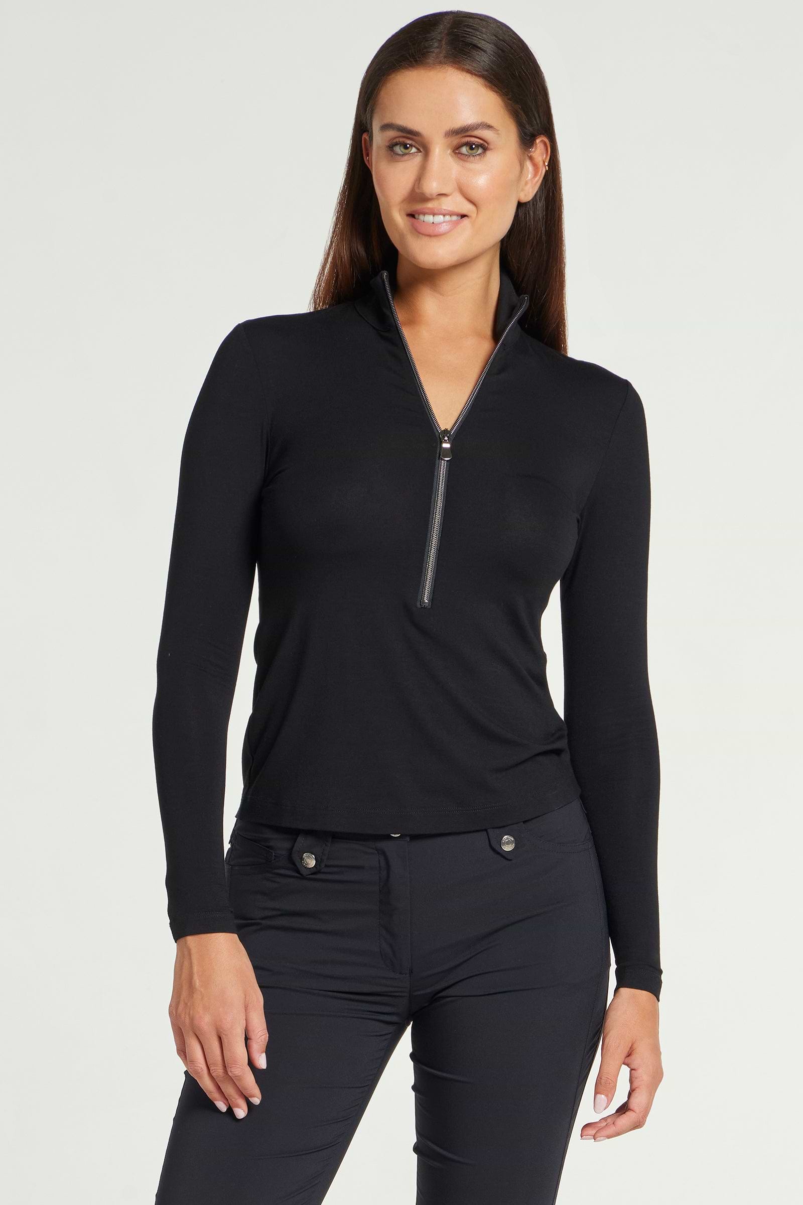 The Best Travel Top. Woman Showing the Front Profile of a Stacey Top in Black.