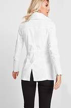 The Best Travel Jacket. Woman Showing the Back Profile of a Travel City Slick Jacket in White