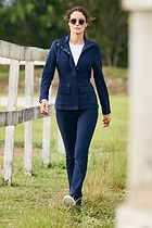 The Best Travel Pants. Lifestyle Image of Woman in the Skyler Cozy Fleece-Lined Travel Pant in Navy
