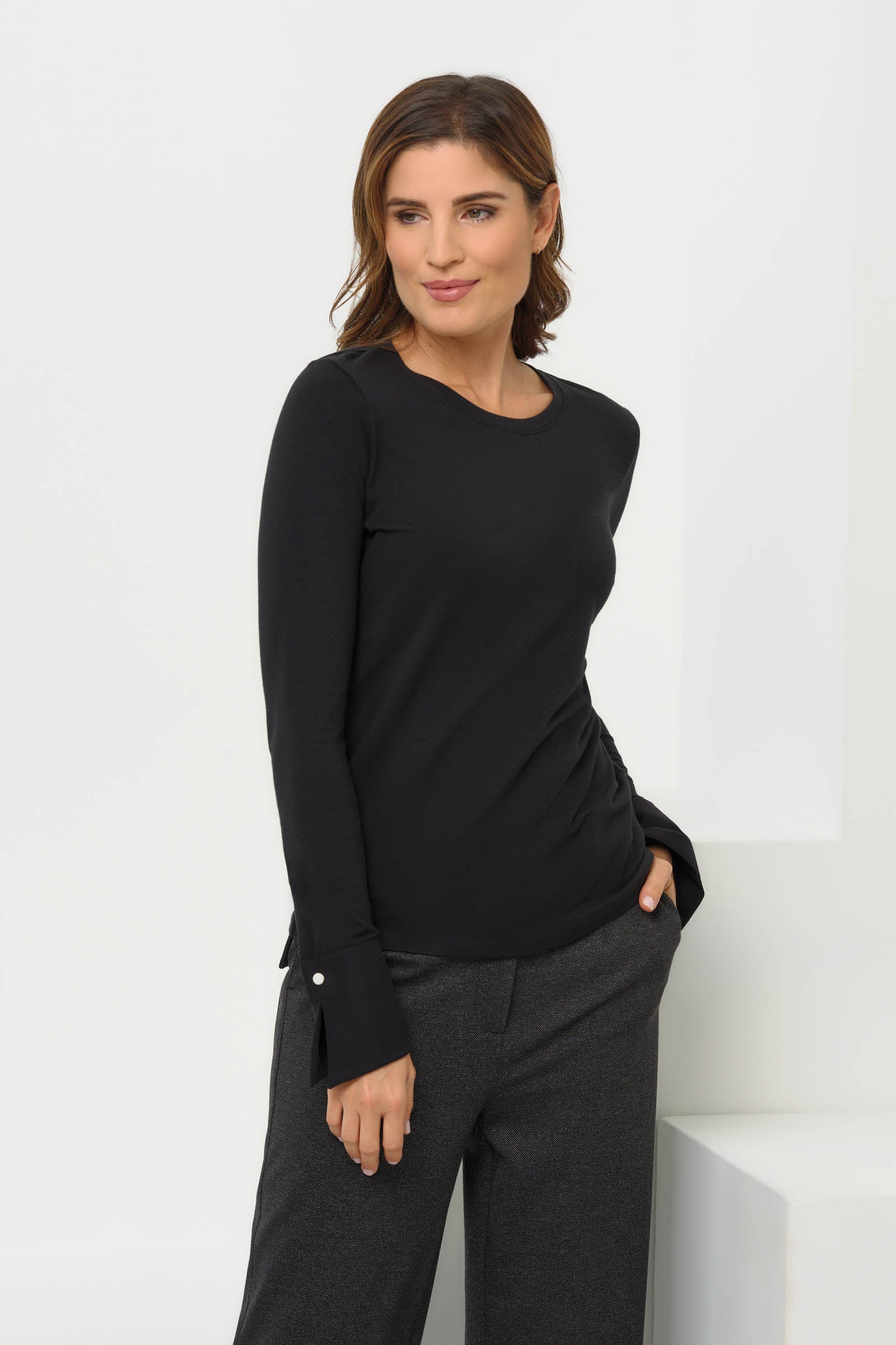 Front view of the Mayven Crewneck Top by Anatomie, highlighting the slim fit and tailored cuffs.