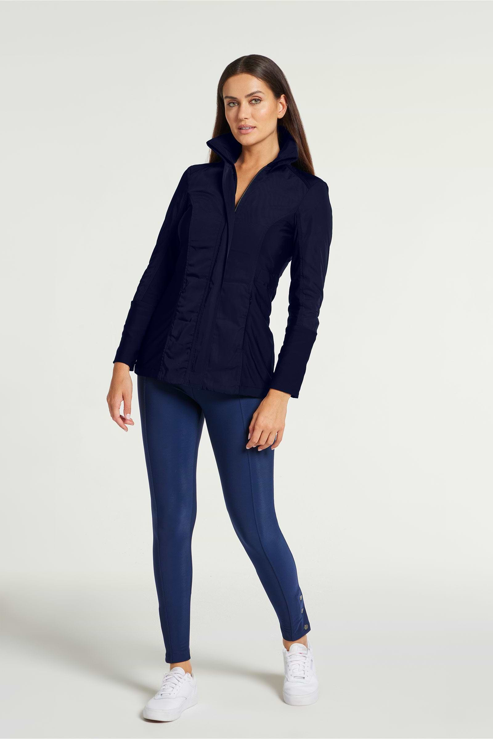 The Best Travel Jacket. Woman Showing the Front Profile of a Travel City Slick Jacket in Navy