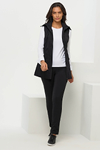 The Best Travel Vest. Woman Showing the Front Profile of a Delaney Travel Vest in Black.