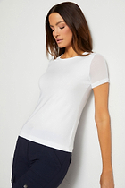 The Best Travel Shirt. Woman Showing the Front Profile of a Melissa Pima Cotton T-Shirt in White