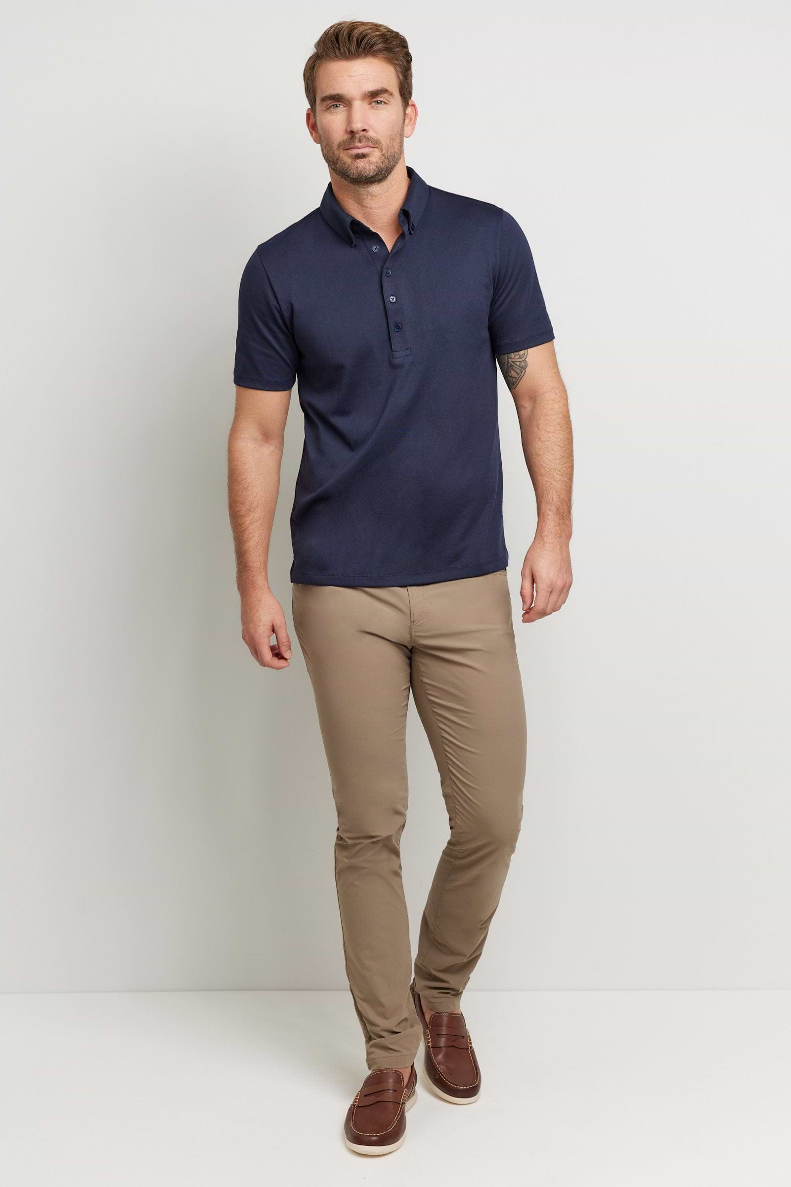 The Best Travel Top. Man Showing the Front Profile of a Men's Ryan Polo in Navy.