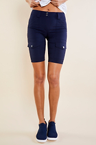 The Best Travel Shorts. Woman Showing the Front Profile of an Apiedi Shorts in Navy.