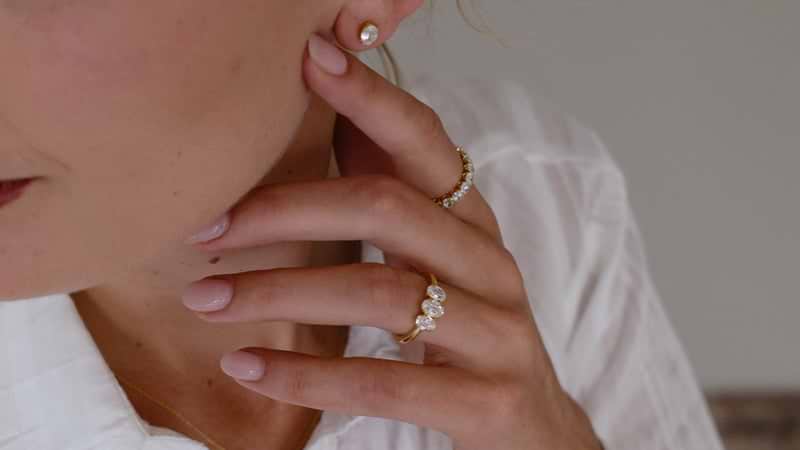 Antique Oval Cut 3 Stone engagement ring on hand