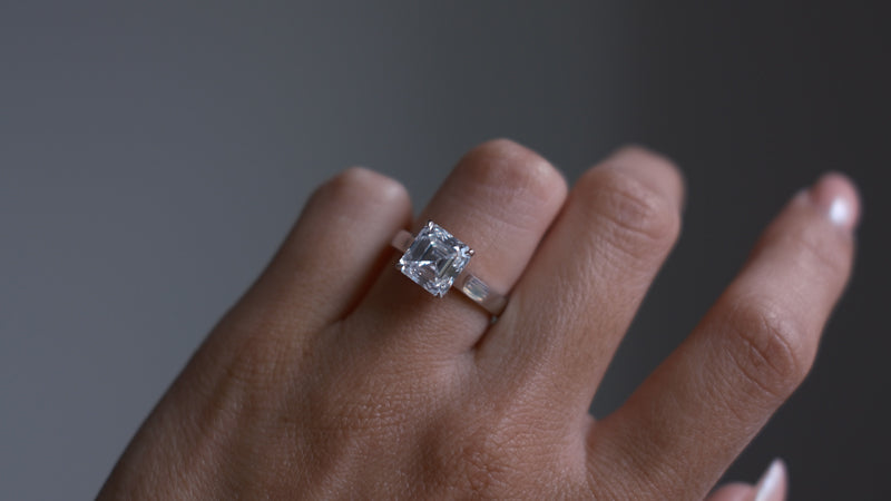 Asscher cut solitaire ring on hand