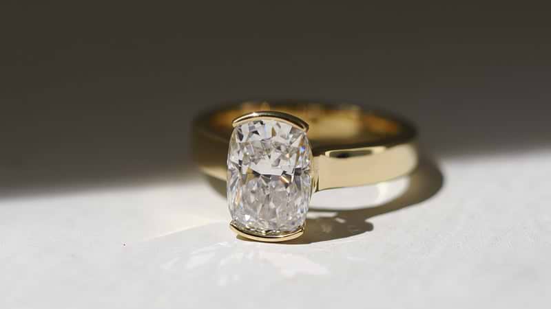 Cushion Cut Yellow Gold Half Bezel Engagement Ring